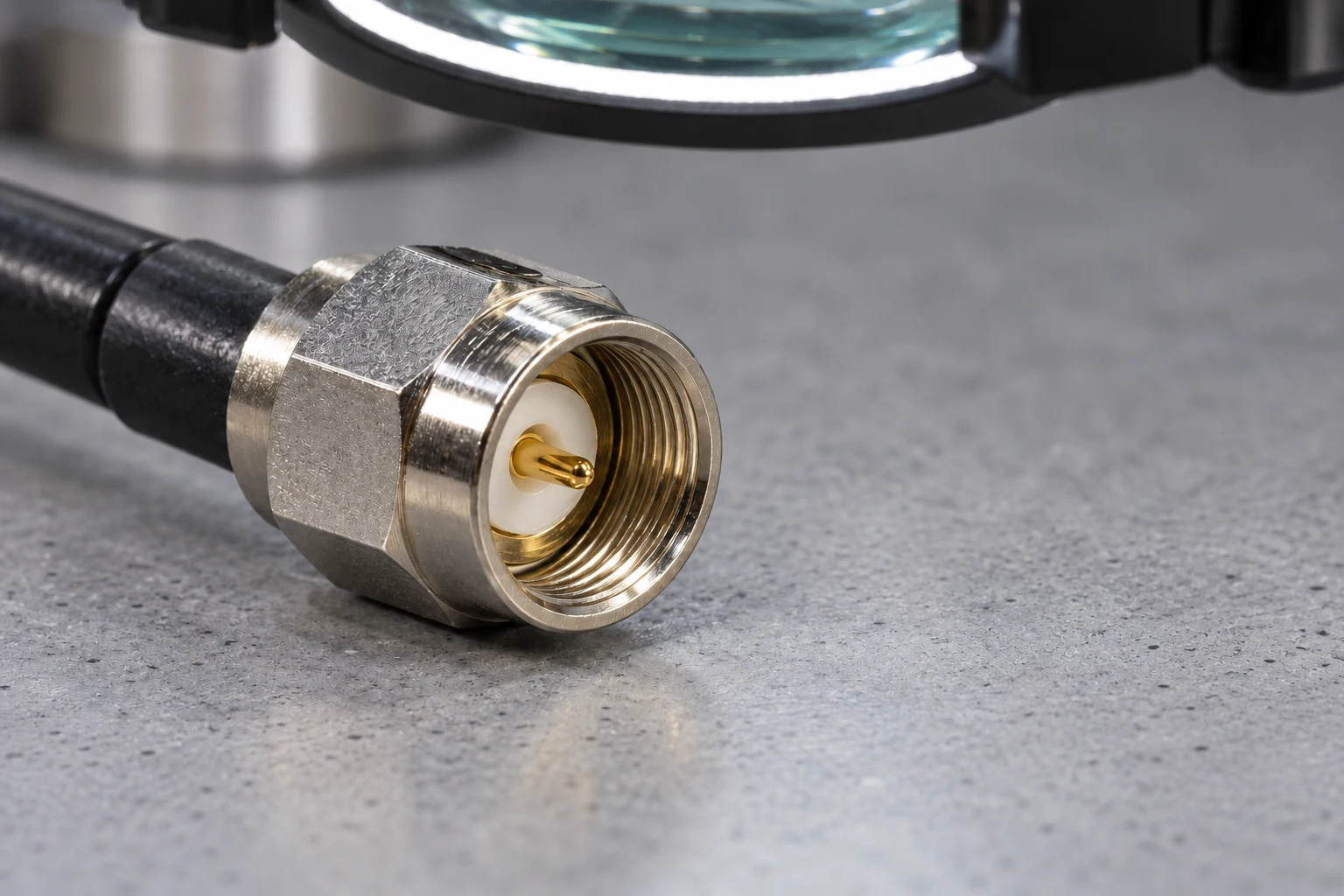 Connector mating face with inspection magnifier in background
